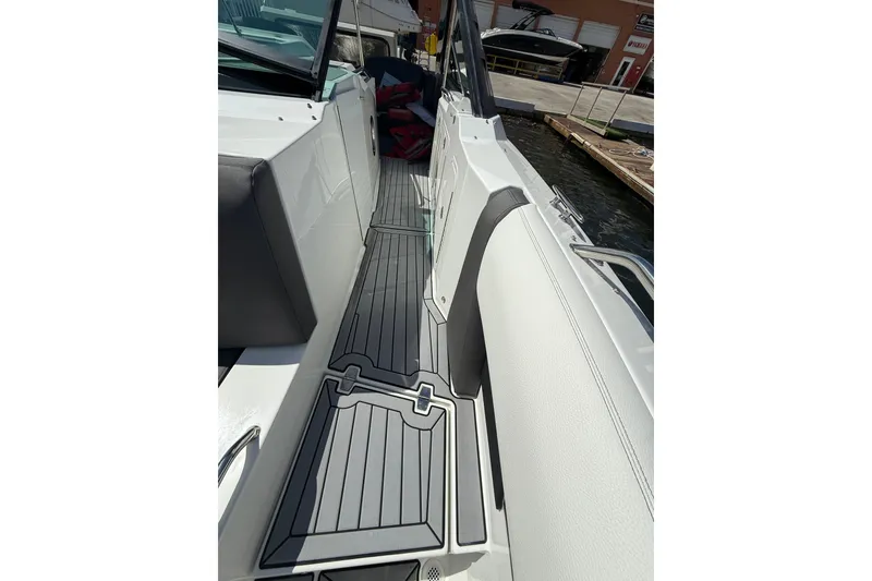 Slide: The Image of 2019 Cruisers Yachts 338 Outboard deck with sleek seating and modern flooring. - 17