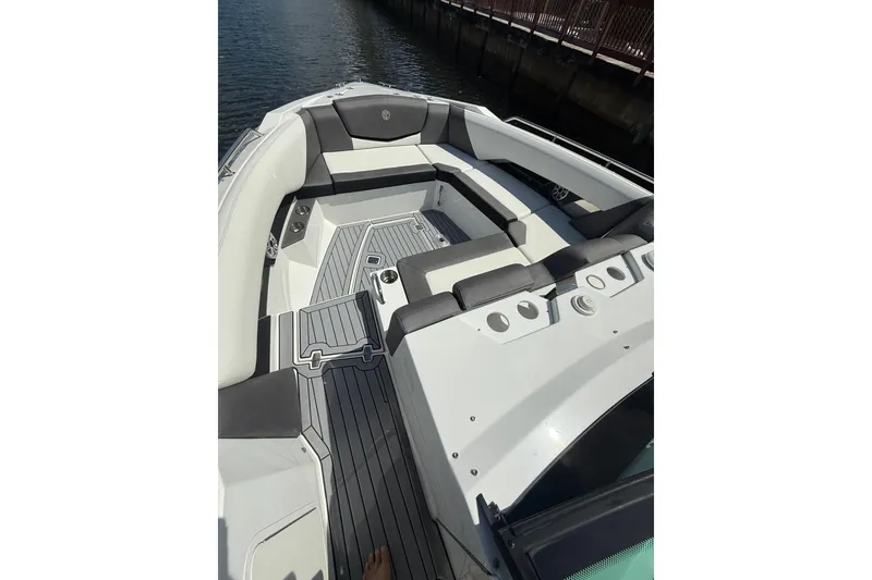 Slide: The Image of 2019 Cruisers Yachts 338 Outboard boat interior with sleek seating and modern design. - 18