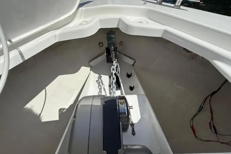Slide: The Image of 2019 Cruisers Yachts 338 Outboard anchor compartment with chain and winch. - 23