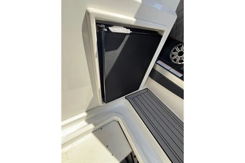 Slide: The Image of 2019 Cruisers Yachts 338 Outboard interior with built-in storage compartment. - 24