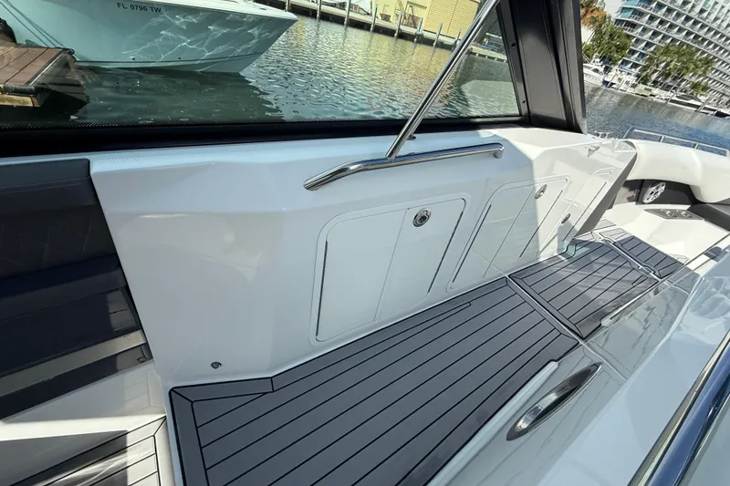 Slide: The Image of 2019 Cruisers Yachts 338 Outboard interior with sleek deck and modern design. - 25