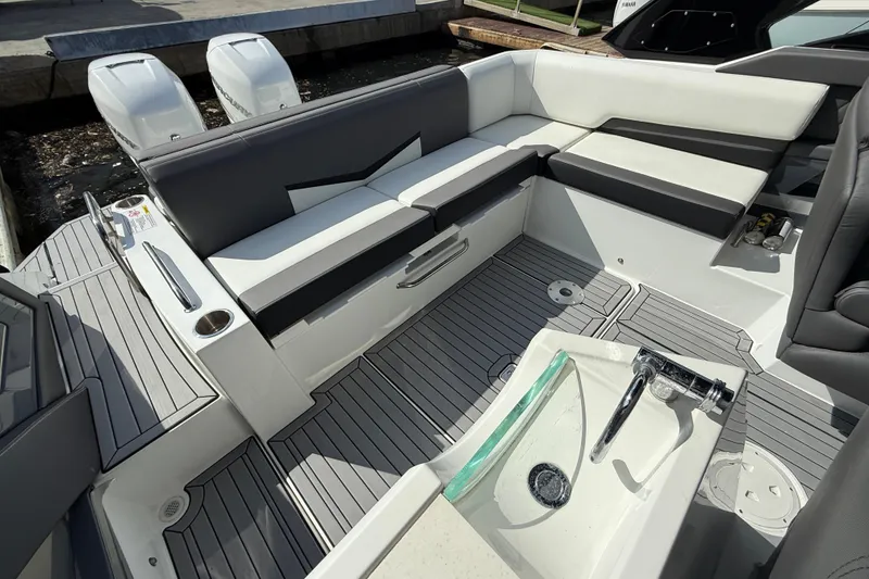 Slide: The Image of 2019 Cruisers Yachts 338 Outboard interior with seating and deck view. - 27
