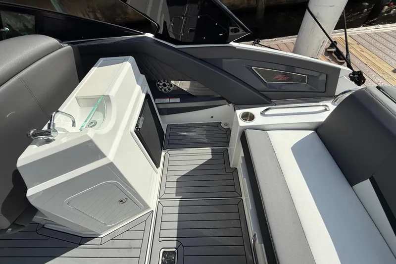 Slide: The Image of 2019 Cruisers Yachts 338 Outboard interior with sink, seating, and modern design. - 28