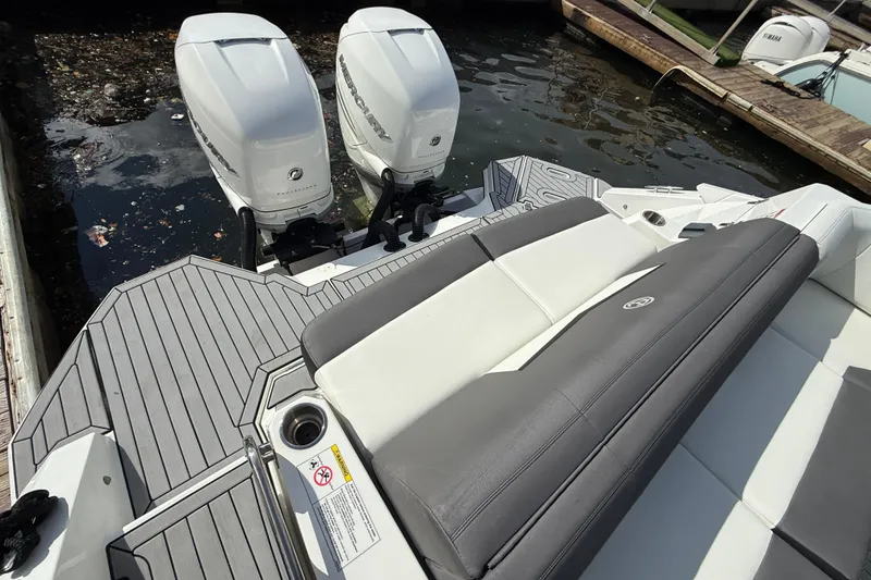 Slide: The Image of 2019 Cruisers Yachts 338 Outboard with dual engines and sleek seating on deck. - 30