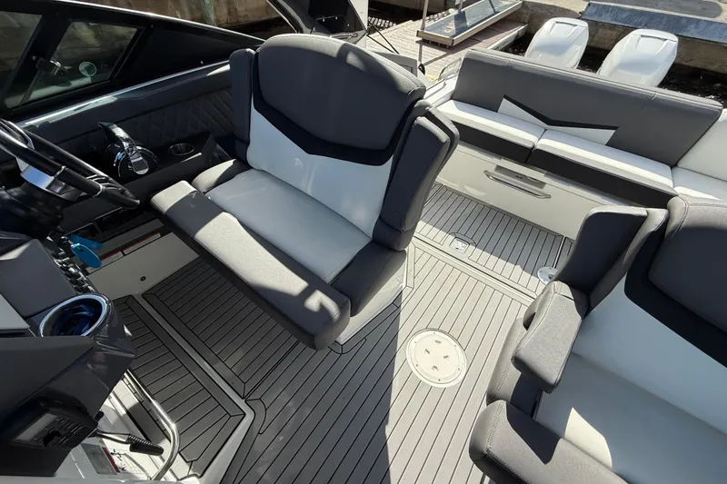 Slide: The Image of 2019 Cruisers Yachts 338 Outboard interior with modern seating and sleek design. - 31