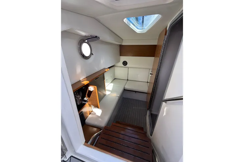 Slide: The Image of 2019 Cruisers Yachts 338 Outboard cabin interior with seating and skylight. - 35