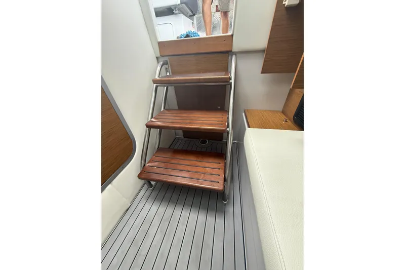 Slide: The Image of Wooden steps inside 2019 Cruisers Yachts 338 Outboard, featuring sleek interior design. - 39