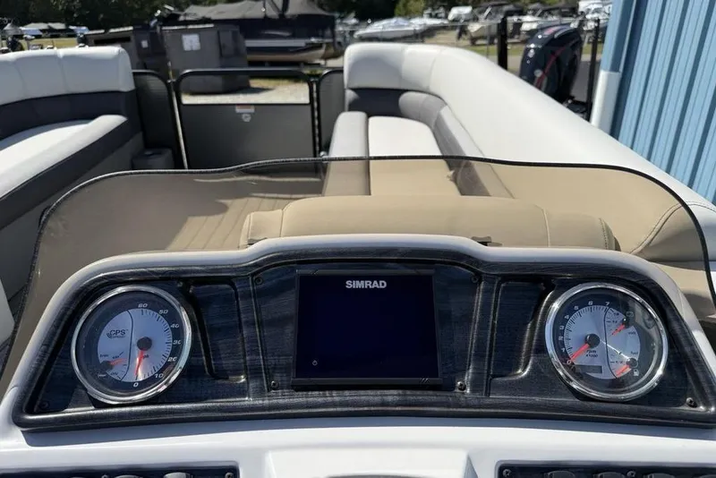 Slide: The Image of Dashboard of a 2021 Godfrey SW 2286 SFL GTP boat with gauges and Simrad display. - 16