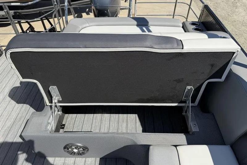 Slide: The Image of 2021 Godfrey SW 2286 SFL GTP boat seat with storage compartment open. - 23