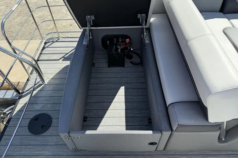 Slide: The Image of Open storage compartment on a 2021 Godfrey SW 2286 SFL GTP pontoon boat. - 26