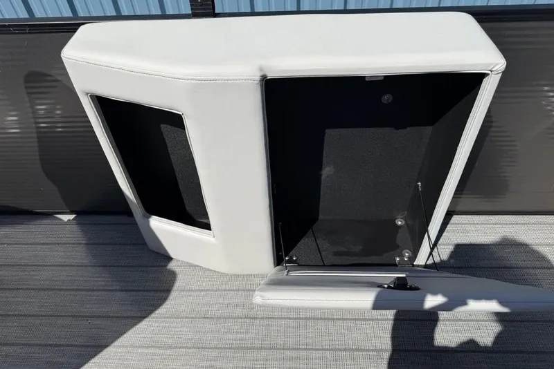 Slide: The Image of Open storage compartment on a 2021 Godfrey SW 2286 SFL GTP boat. - 28