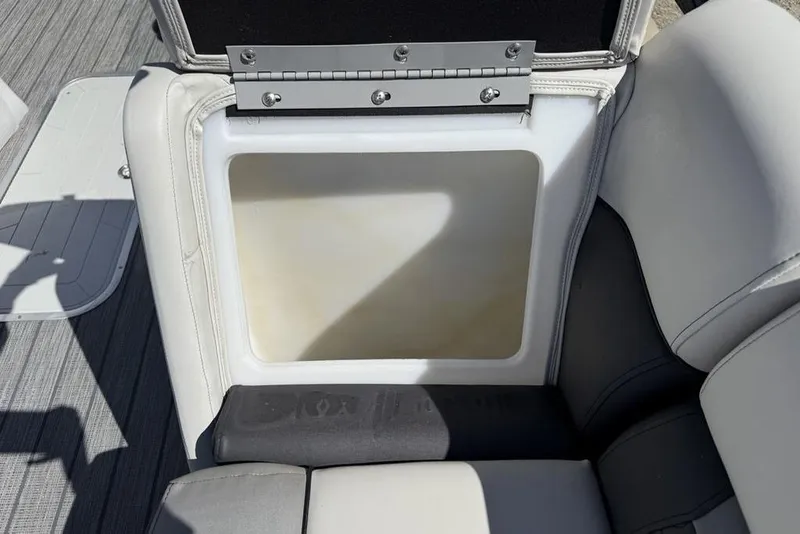 Slide: The Image of 2021 Godfrey SW 2286 SFL GTP boat seat storage compartment, open and empty. - 6