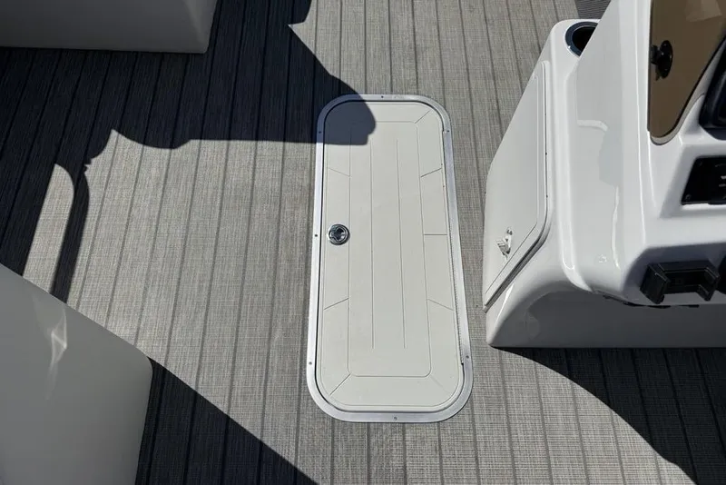 Slide: The Image of Deck of 2021 Godfrey SW 2286 SFL GTP boat with storage hatch. - 9