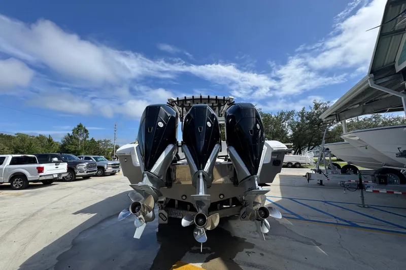 Slide: The Image of 2020 Fountain 38 Tournament Edition boat with triple outboard engines in a marina. - 11