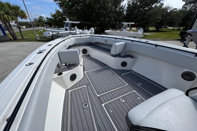 Slide: The Image of 2020 Fountain 38 Tournament Edition boat interior with seating and storage compartments. - 16