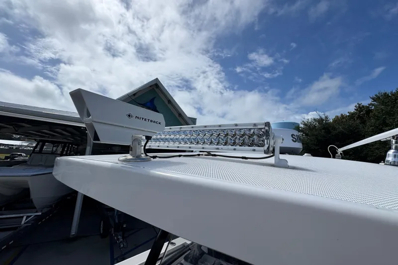 Slide: The Image of 2020 Fountain 38 Tournament Edition boat with Nitetack equipment under a partly cloudy sky. - 21