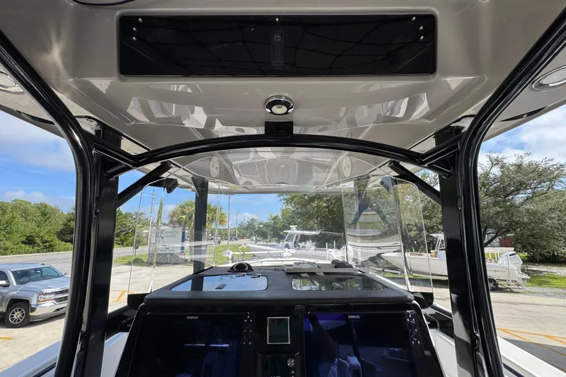 Slide: The Image of 2020 Fountain 38 Tournament Edition boat interior with navigation equipment and clear canopy view. - 29