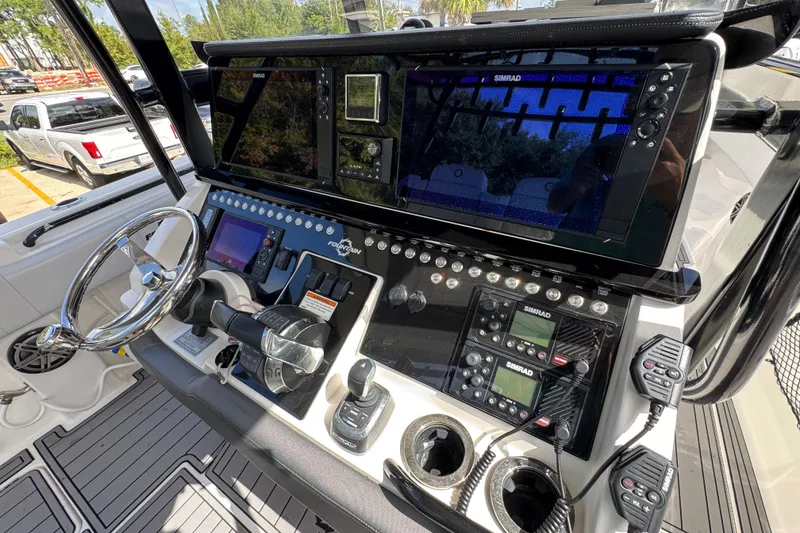 Slide: The Image of 2020 Fountain 38 Tournament Edition boat dashboard with advanced navigation and control systems. - 30