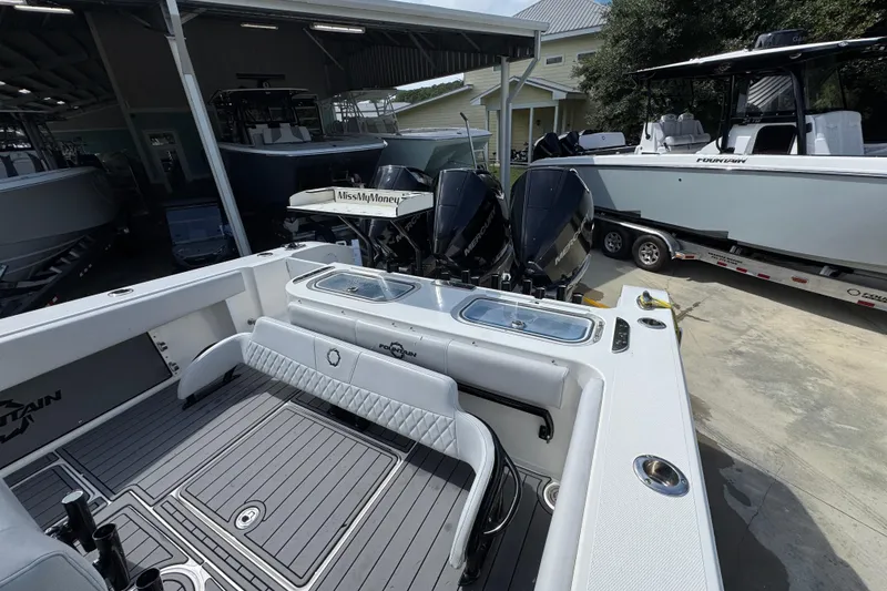 Slide: The Image of 2020 Fountain 38 Tournament Edition boat with dual Mercury engines in a showroom. - 35