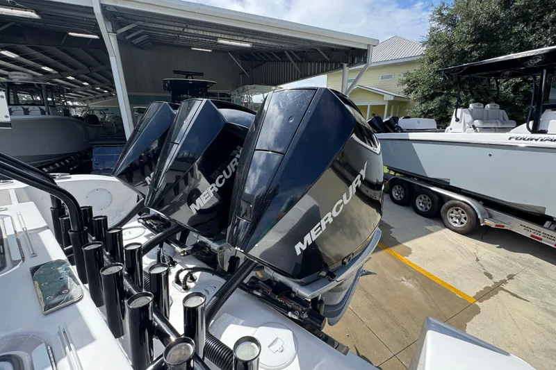 Slide: The Image of 2020 Fountain 38 Tournament Edition with Mercury outboard engines in a marina setting. - 38