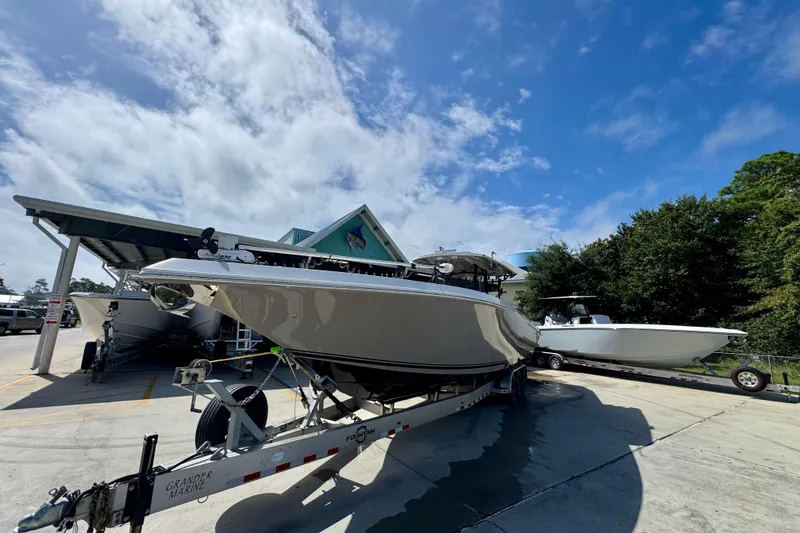 Slide: The Image of 2020 Fountain 38 Tournament Edition boat on trailer under blue sky. - 4