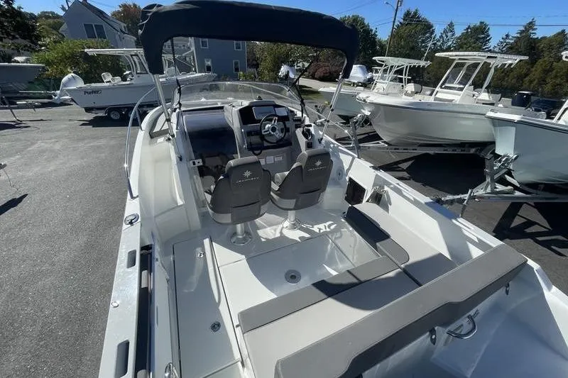 Slide: The Image of 2022 Jeanneau 7.5 Leader boat with dual seats and sleek interior design. - 3