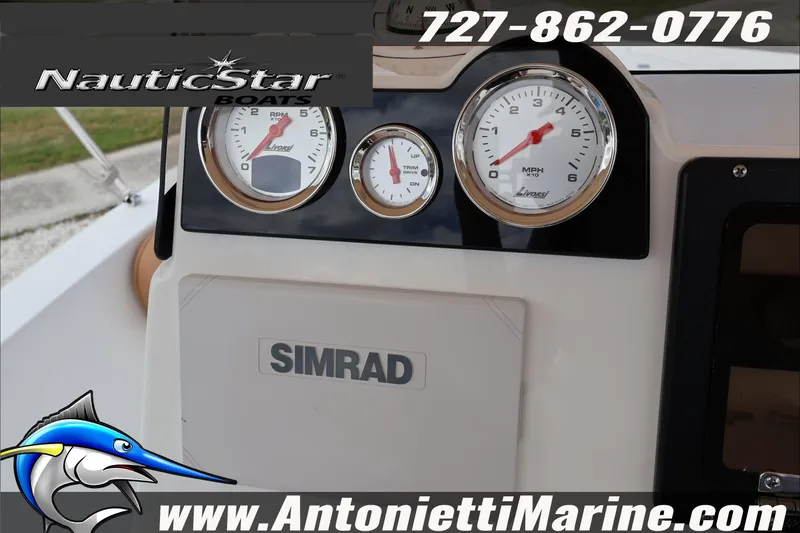 Slide: The Image of Dashboard of 2026 NauticStar 191 Hybrid boat with gauges and Simrad display. - 14