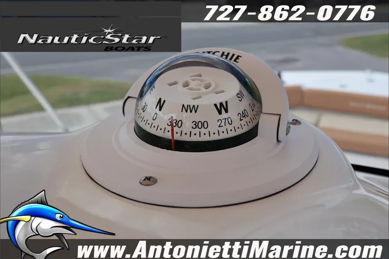 Slide: The Image of Compass on NauticStar 191 Hybrid boat, 2026 model, with contact details and logo. - 15
