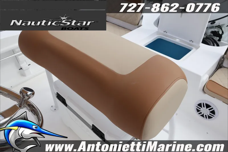 Slide: The Image of 2026 NauticStar 191 Hybrid boat interior with tan seating and storage compartment. - 23