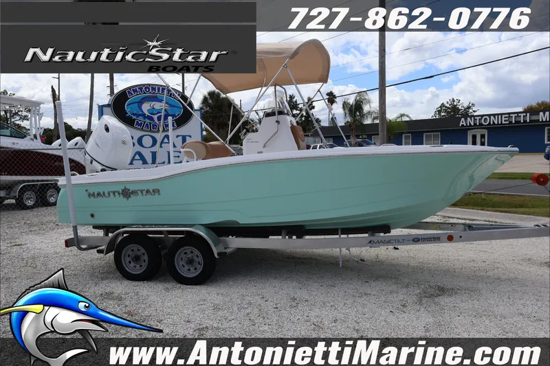 Slide: The Image of 2026 NauticStar 191 Hybrid boat on trailer at Antonietti Marine dealership. - 4