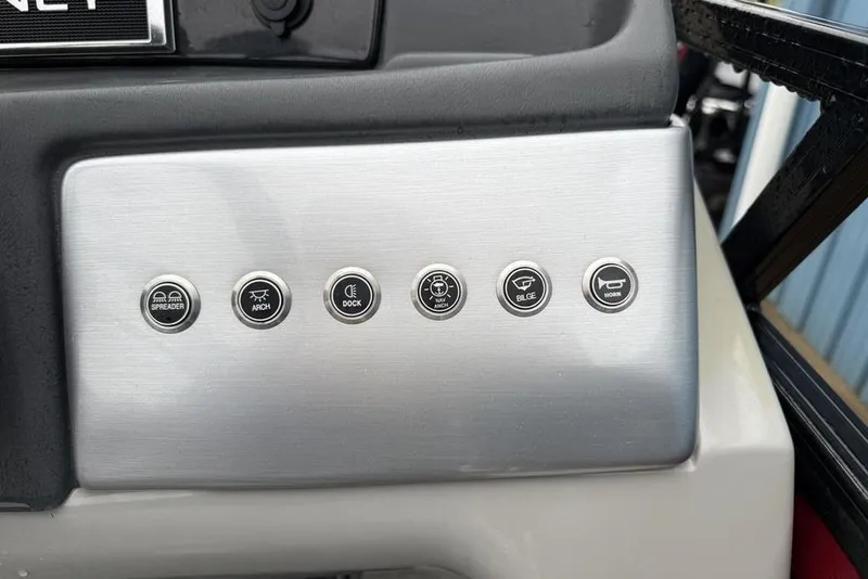 Slide: The Image of Control panel of 2023 Regency 250 DL3 boat with labeled buttons. - 11