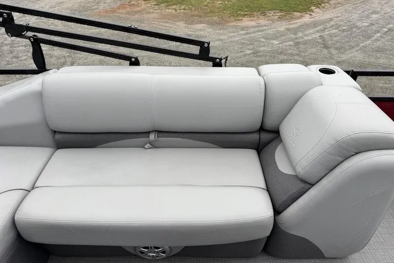 Slide: The Image of 2023 Regency 250 DL3 boat with luxurious gray seating and cup holder. - 13