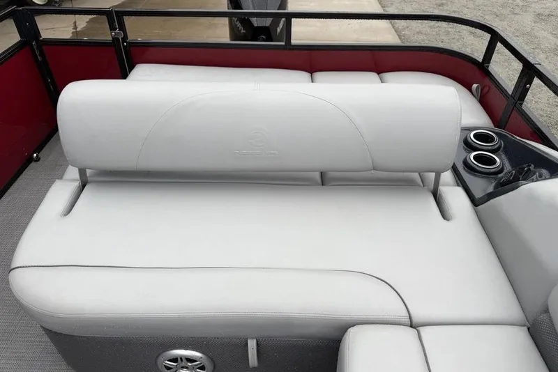 Slide: The Image of 2023 Regency 250 DL3 boat interior with white seating and cup holders. - 18