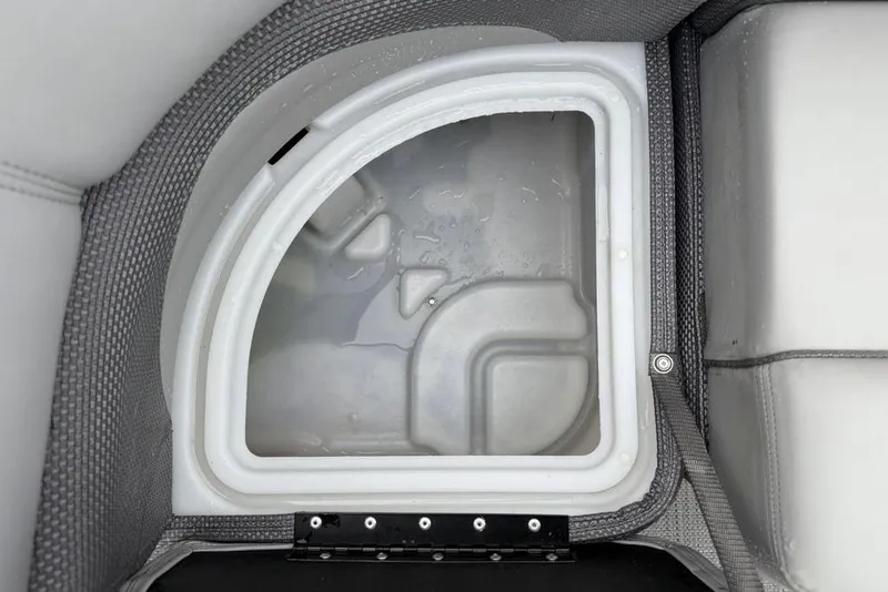 Slide: The Image of 2023 Regency 250 DL3 boat storage compartment with water inside. - 2