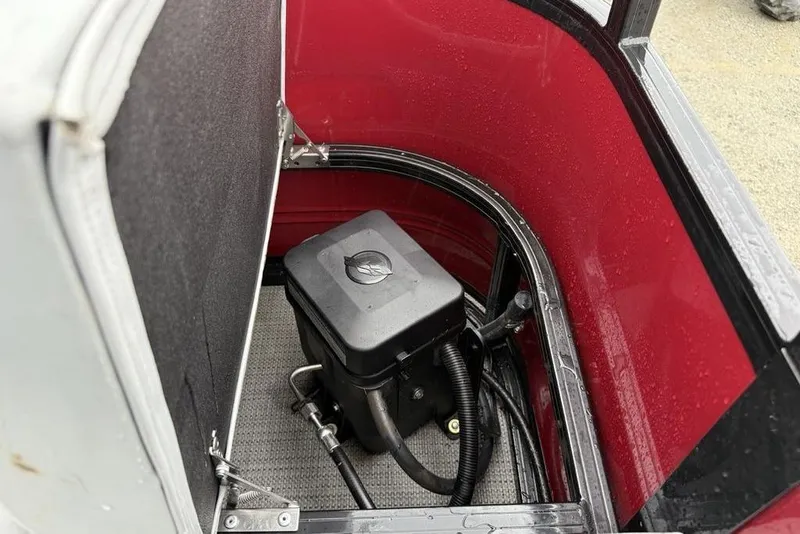 Slide: The Image of 2023 Regency 250 DL3 storage compartment with black box and red interior. - 21