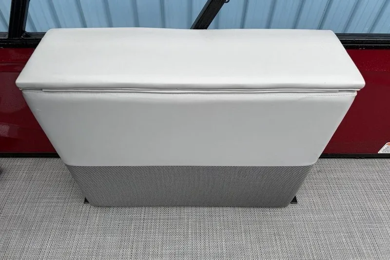 Slide: The Image of 2023 Regency 250 DL3 boat seat with gray upholstery and red background. - 23
