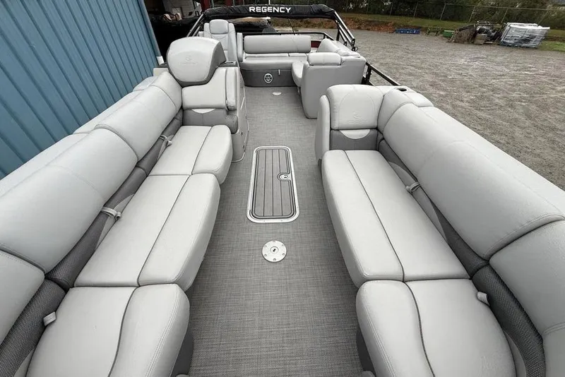 Slide: The Image of Luxurious interior of 2023 Regency 250 DL3 pontoon boat with plush seating. - 24