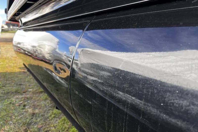 Slide: The Image of 2023 Regency 250 DL3 boat with reflective black exterior finish. - 28