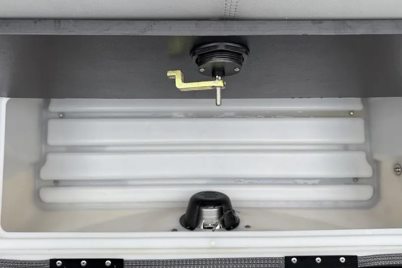 Slide: The Image of 2023 Regency 250 DL3 storage compartment with latch and interior view. - 35