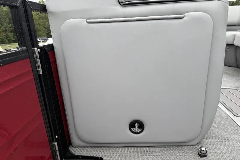 Slide: The Image of 2023 Regency 250 DL3 boat interior with gray upholstery and red paneling. - 4