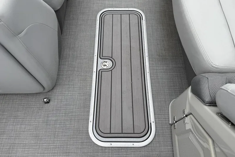 Slide: The Image of 2023 Regency 250 DL3 boat interior with gray flooring and storage compartment. - 8