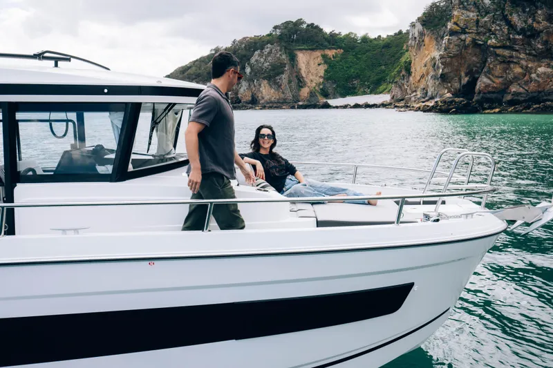 Slide: The Image of Couple enjoying a day on the 2026 Jeanneau NC 895 Sport Series 2 boat. - 10