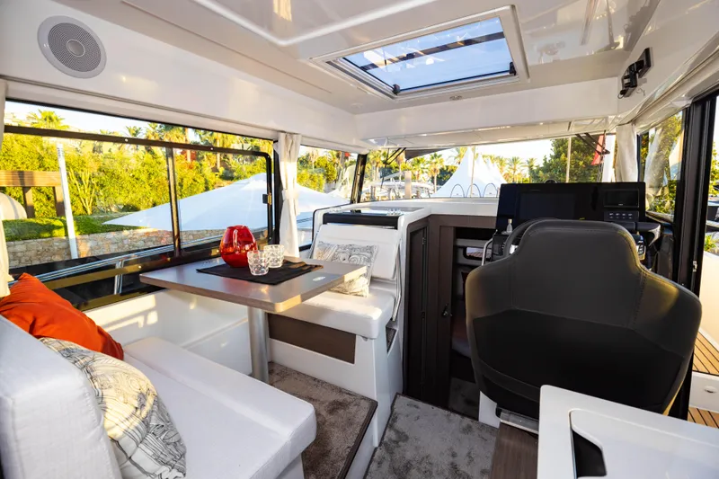 Slide: The Image of Interior of 2026 Jeanneau NC 895 Sport Series 2, featuring modern seating and helm. - 19