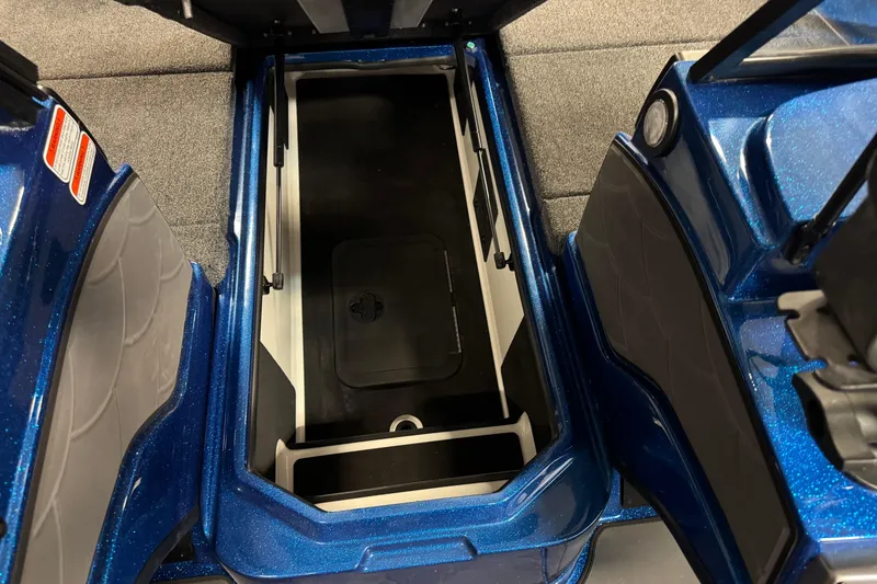 Slide: The Image of Open storage compartment in 2026 Nitro ZV20 Sport Pro boat, featuring blue interior design. - 13