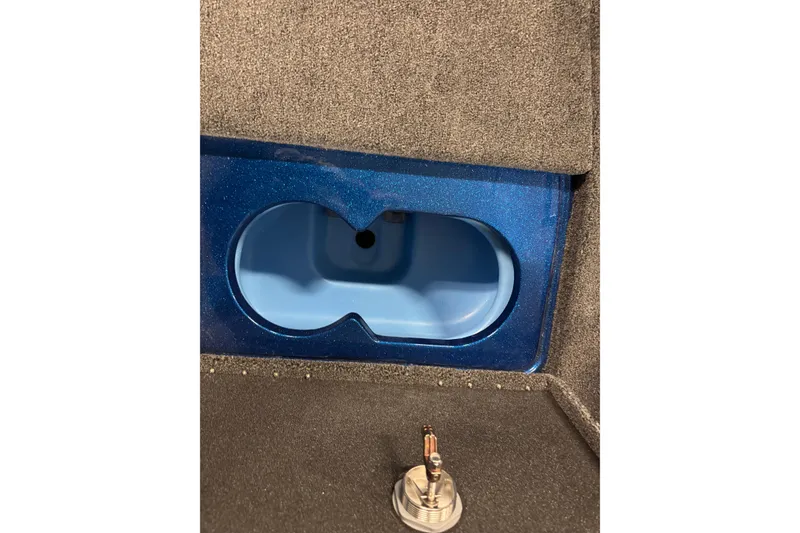 Slide: The Image of Interior compartment of 2026 Nitro ZV20 Sport Pro boat, featuring a blue storage area. - 14