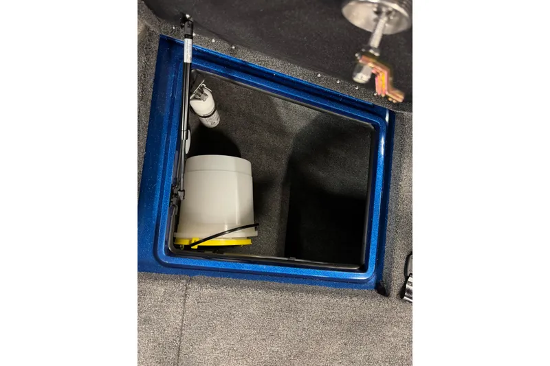 Slide: The Image of Storage compartment in 2026 Nitro ZV20 Sport Pro boat, featuring a white container. - 16