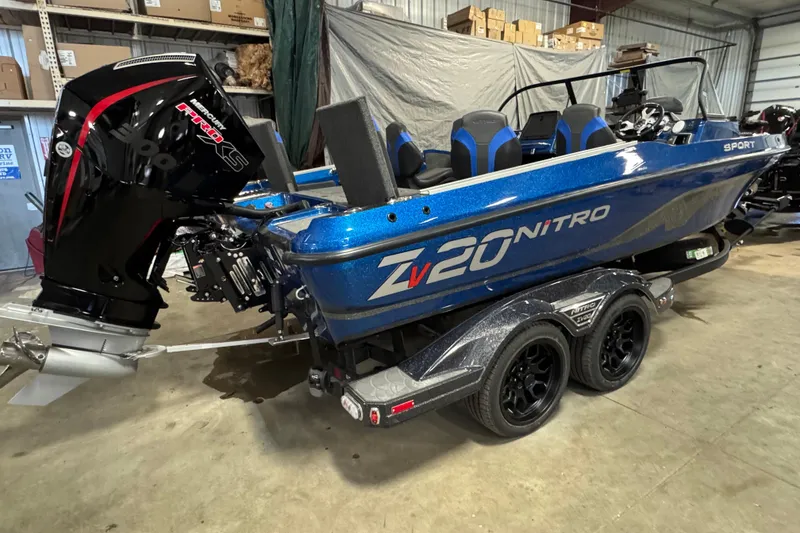 Slide: The Image of 2026 Nitro ZV20 Sport Pro boat with powerful engine in a garage setting. - 4