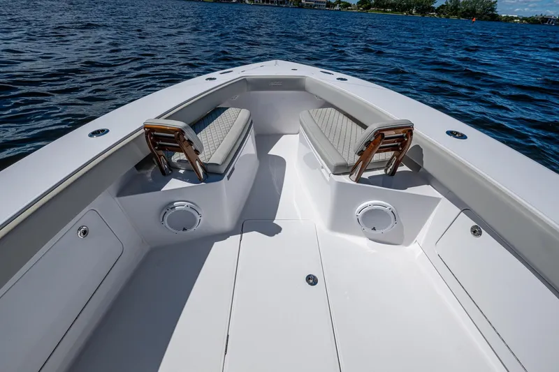 Slide: The Image of Bow seating area of 2022 Jupiter 32 boat on water. - 12