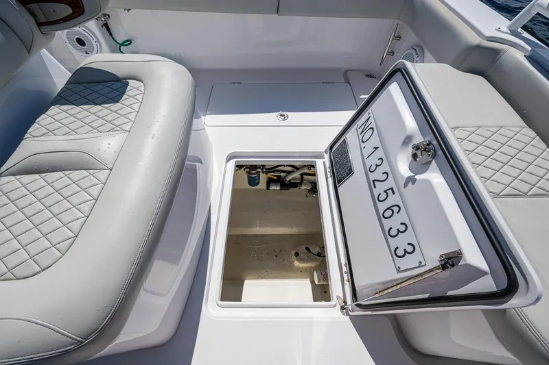 Slide: The Image of 2022 Jupiter 32 boat interior with open hatch and quilted seating. - 19