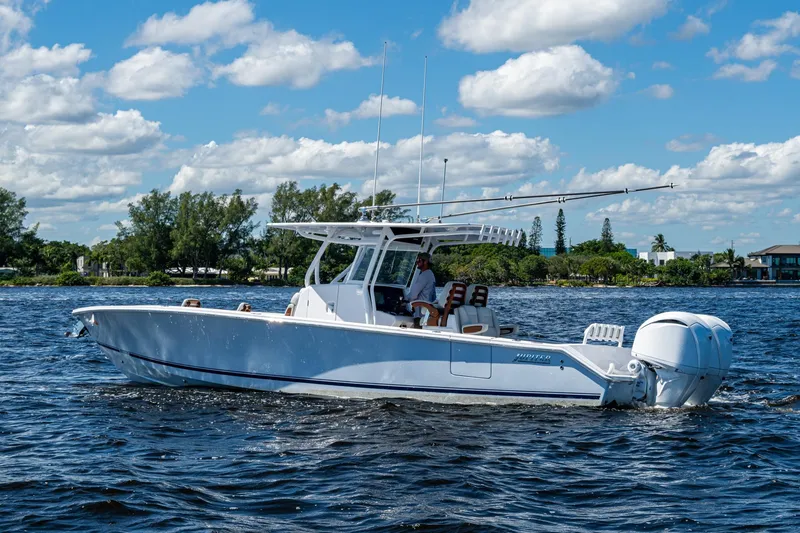 Slide: The Image of 2022 Jupiter 32 boat cruising on a sunny day with clear skies and calm waters. - 2
